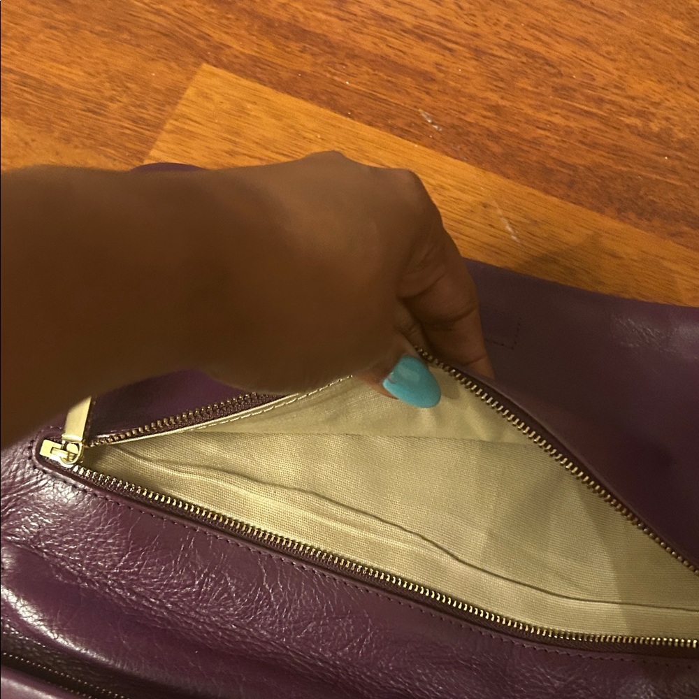 Tory Burch Plum/egg plant Leather Clutch with Gold Accents. - Picture 10 of 16